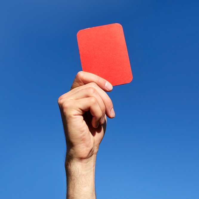 A Red Card Being Held Up