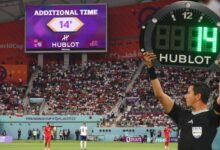 Fourth Official Indicating 14 Minutes of Additional Time