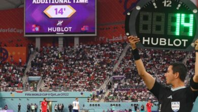 Fourth Official Indicating 14 Minutes of Additional Time