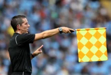 Linesman Waving the Offside Flag
