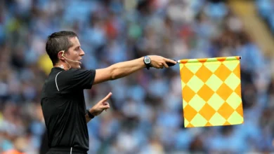 Linesman Waving the Offside Flag