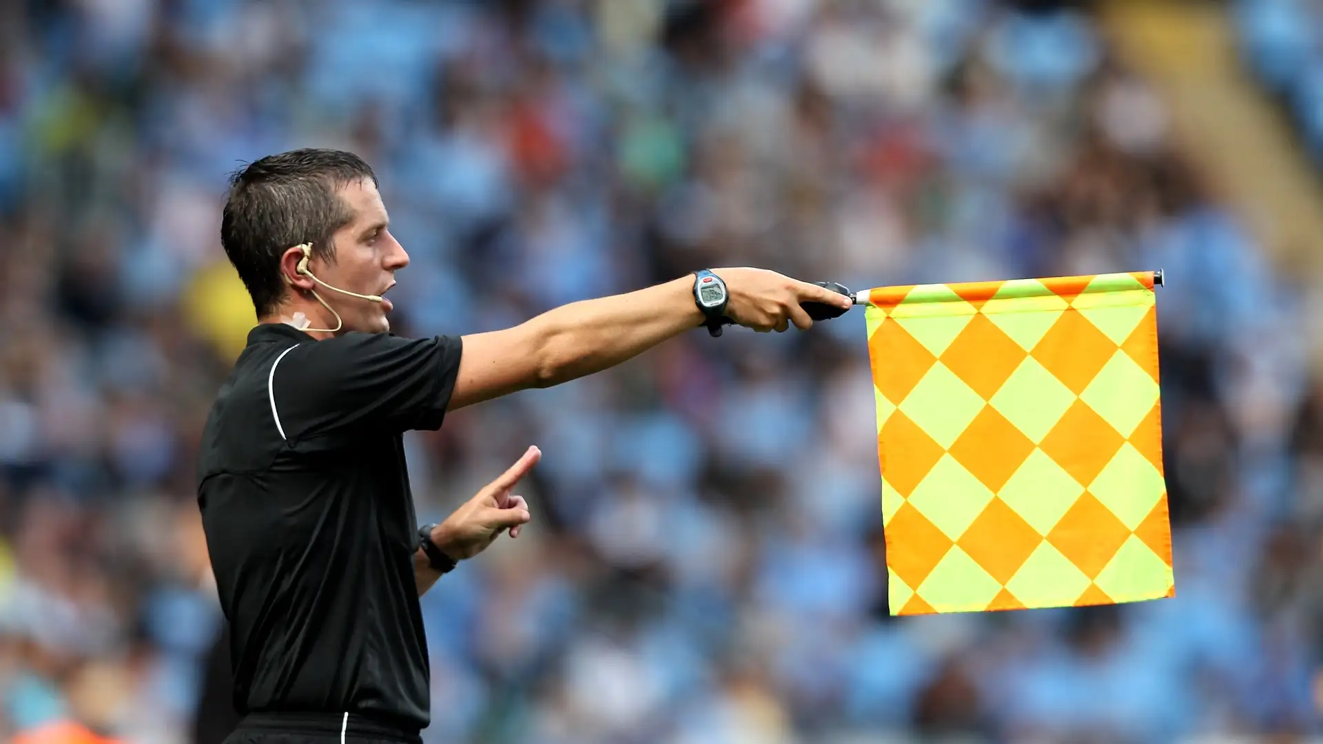 Linesman Waving the Offside Flag