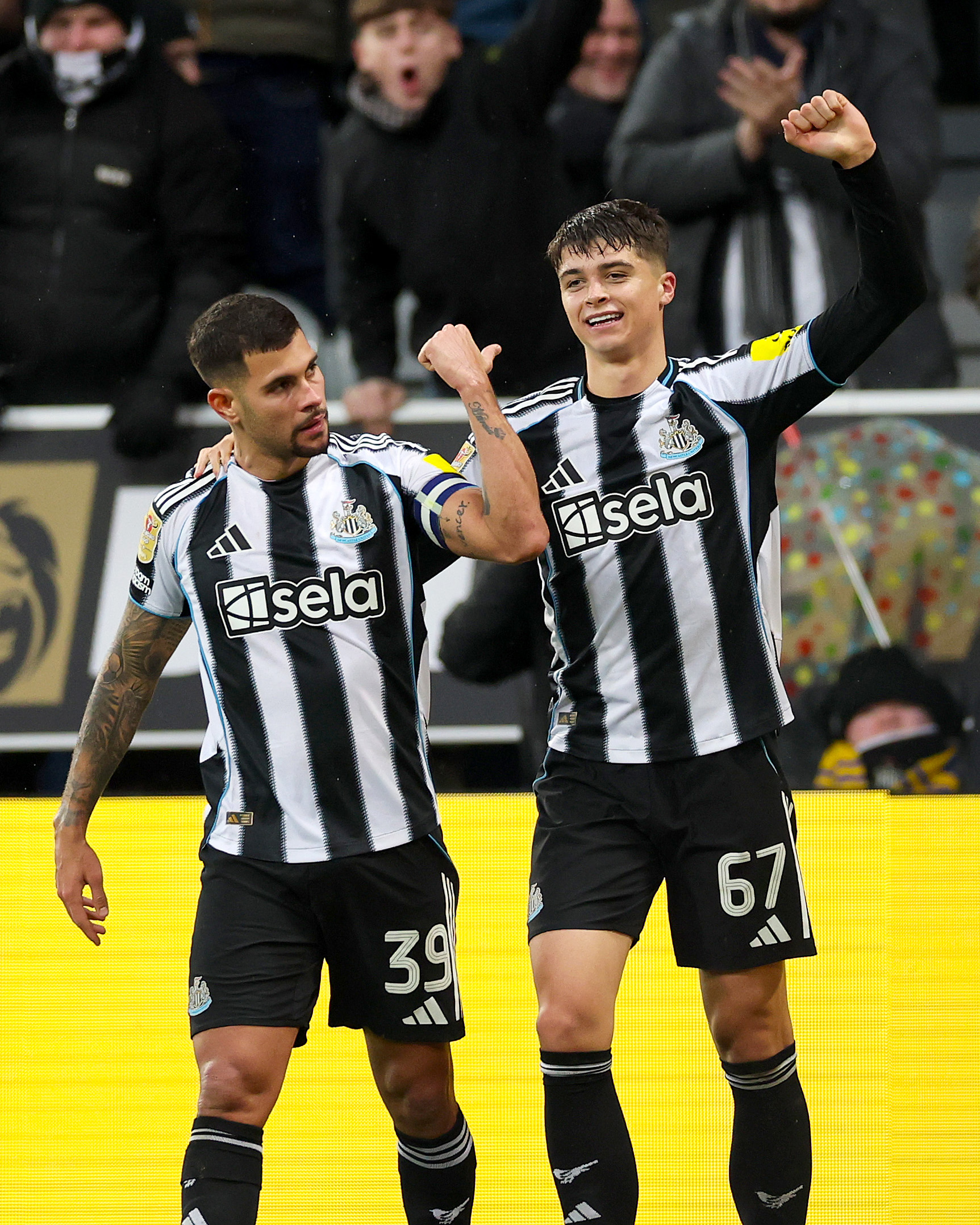 Lewis Miley and Bruno Guimaraes Celebrating The Former's Stoppage Time Winner