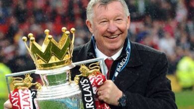 Football's Managerial Merry-go-round Sir Alex Ferguson Holding Up A Premier League Title